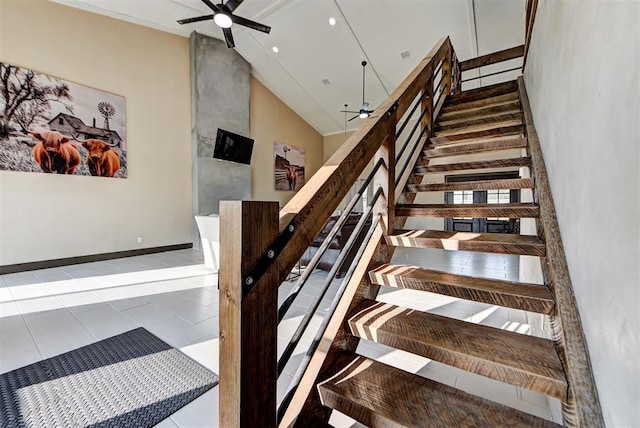 staircase with high vaulted ceiling, tile patterned floors, and ceiling fan