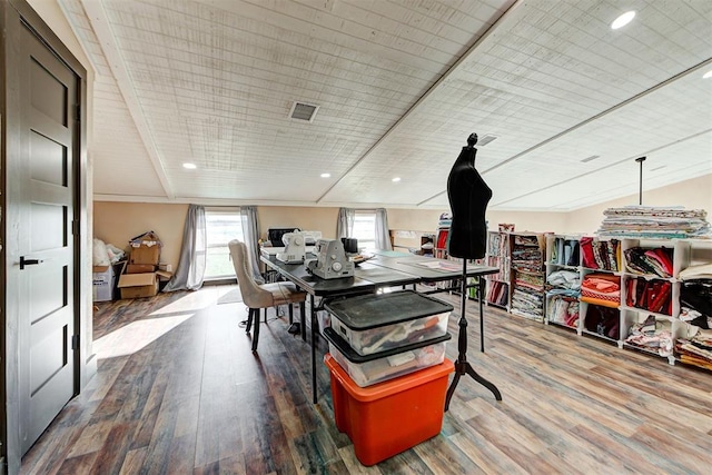 dining room featuring hardwood / wood-style floors and lofted ceiling