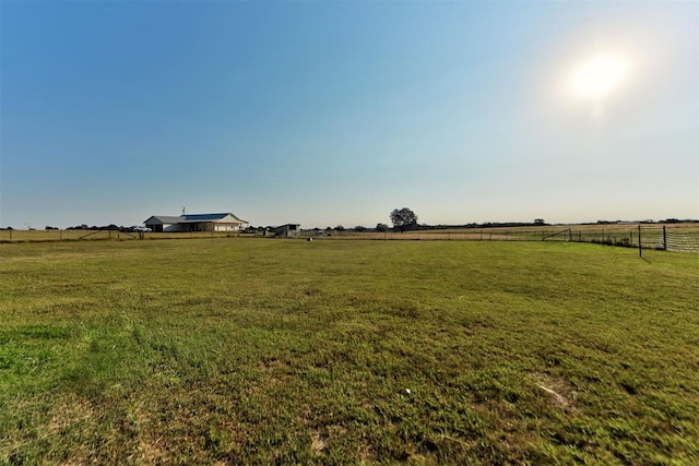 view of yard with a rural view