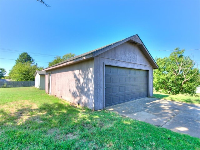 garage featuring a lawn