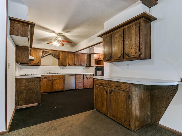 kitchen with dark colored carpet, oven, ceiling fan, and stainless steel dishwasher