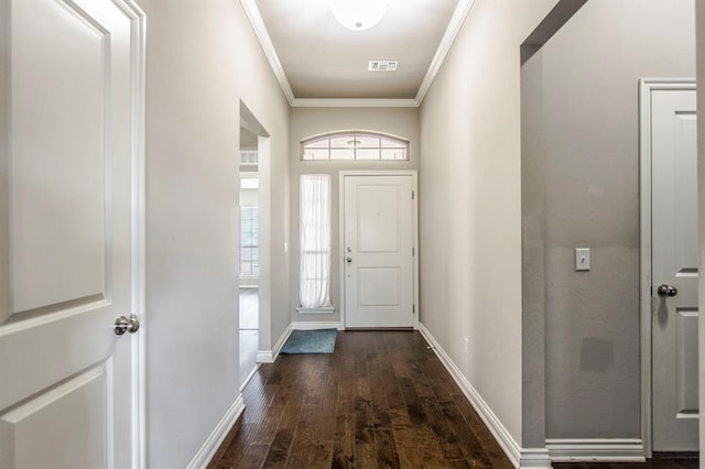 foyer featuring crown molding and dark wood-type flooring