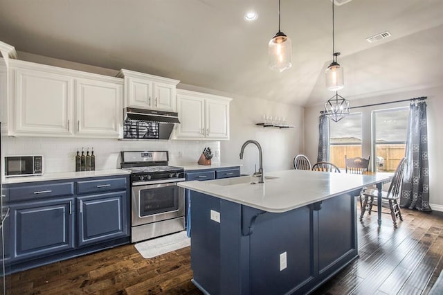 kitchen with sink, stainless steel stove, an island with sink, decorative light fixtures, and white cabinets