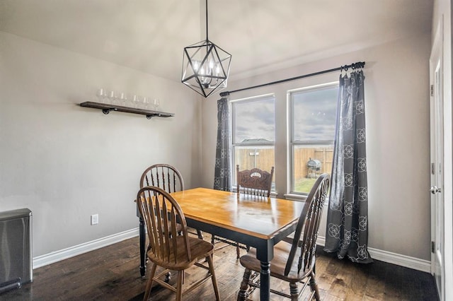 dining room featuring a chandelier and dark hardwood / wood-style flooring