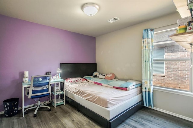 bedroom featuring hardwood / wood-style flooring