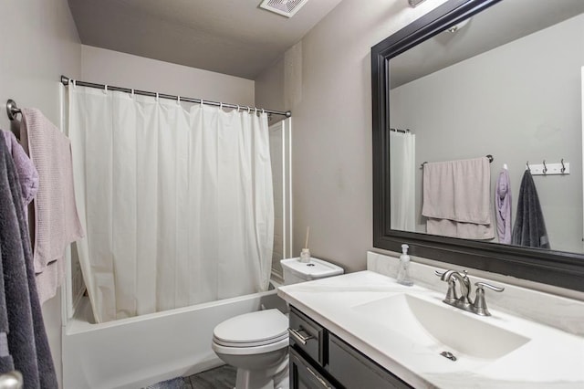 full bathroom with toilet, vanity, and shower / tub combo with curtain