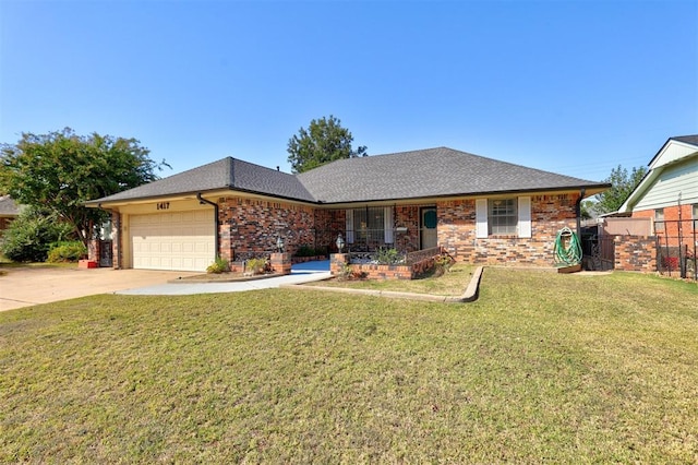 single story home featuring a garage and a front lawn