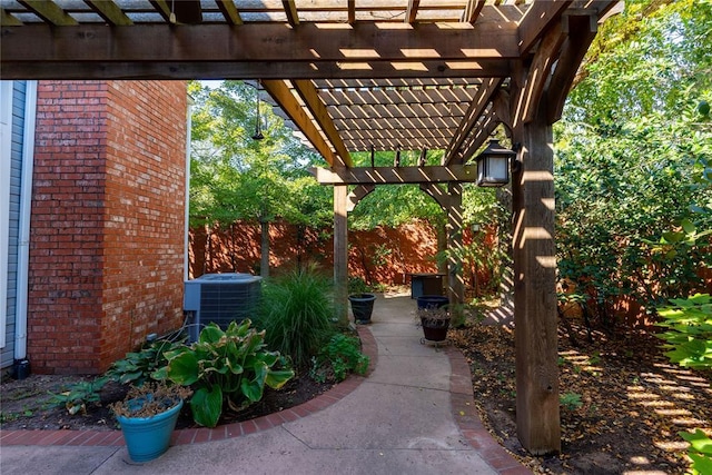 view of patio with a pergola and central AC