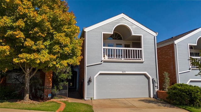 view of front of property with a balcony and a garage