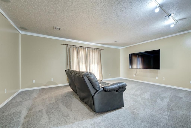 carpeted living room featuring ornamental molding, a textured ceiling, and track lighting