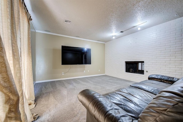 unfurnished living room featuring carpet, a textured ceiling, rail lighting, and ornamental molding