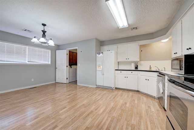 kitchen with stainless steel appliances, a chandelier, pendant lighting, light hardwood / wood-style floors, and white cabinets