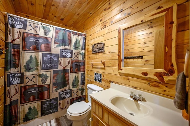 bathroom featuring vanity, wooden ceiling, wooden walls, a shower with shower curtain, and toilet