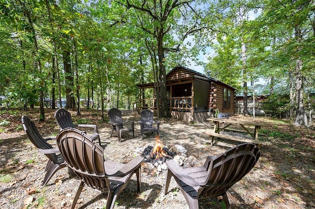 130 Wildwood Trl, Broken Bow, OK 74728 - view of patio featuring a fire pit