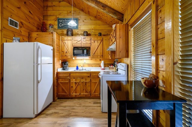 kitchen with sink, lofted ceiling with beams, decorative light fixtures, white appliances, and light wood-type flooring