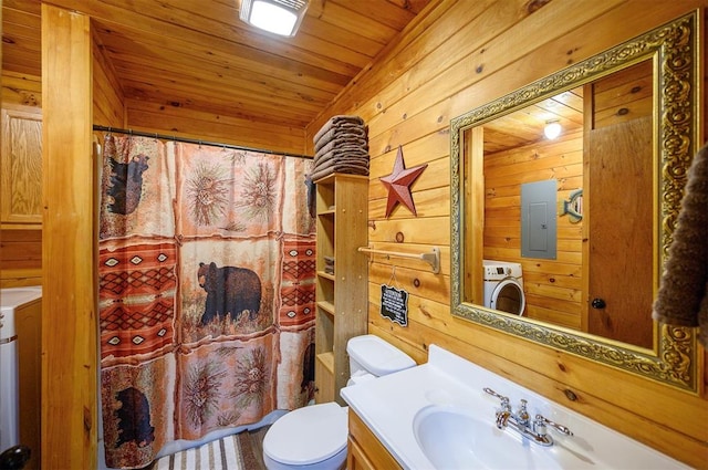 bathroom with vanity, wood walls, wooden ceiling, toilet, and washer / clothes dryer