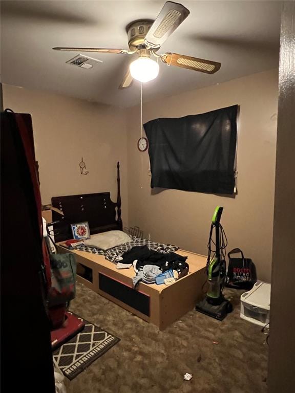 bedroom with ceiling fan and carpet floors