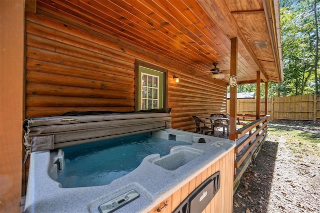 view of patio / terrace featuring a hot tub and ceiling fan