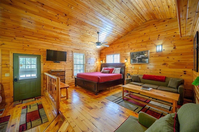 183 Pine Meadow Ln, Broken Bow, OK 74728 - bedroom featuring vaulted ceiling, wood walls, light wood-type flooring, and wooden ceiling