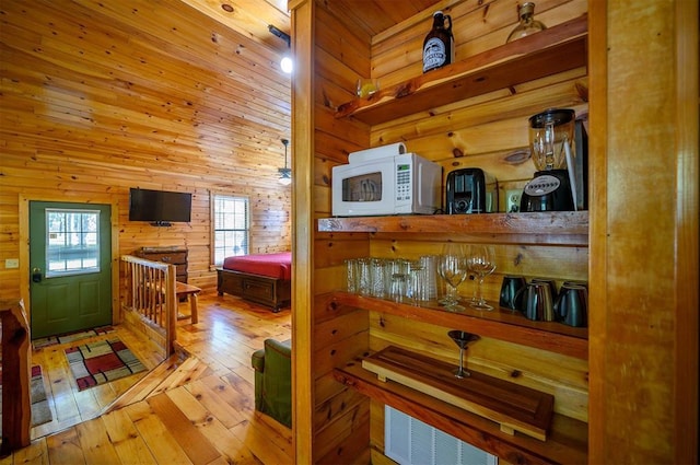 183 Pine Meadow Ln, Broken Bow, OK 74728 - interior space with wooden walls and hardwood / wood-style floors