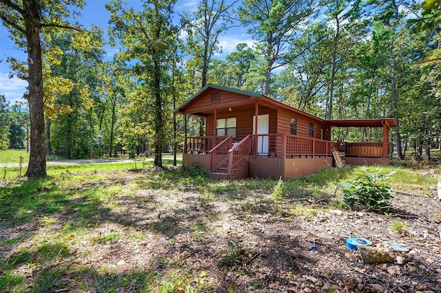 183 Pine Meadow Ln, Broken Bow, OK 74728 - view of outbuilding with a porch