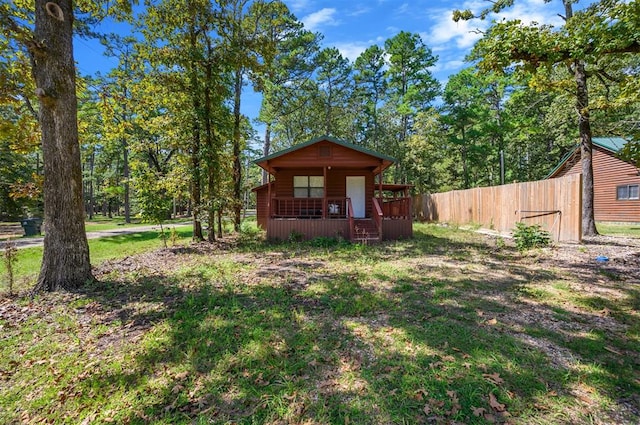 view of yard featuring covered porch