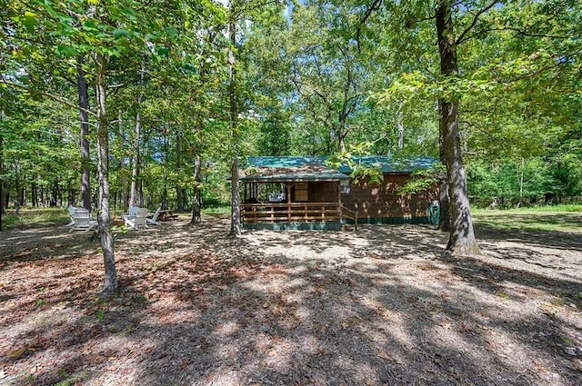183 Pine Meadow Ln, Broken Bow, OK 74728 - view of yard featuring a deck and a forest view