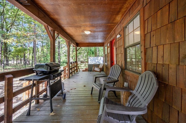 wooden terrace with a porch