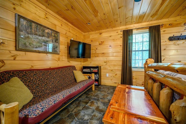 living area with wood ceiling and wood walls