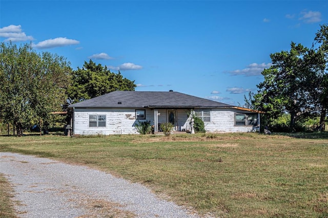 ranch-style home with a front yard