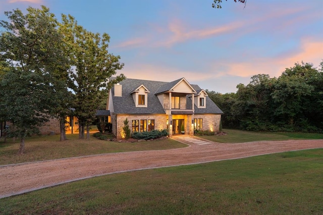 view of front of property with a lawn