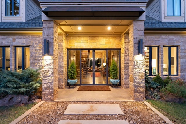 view of exterior entry featuring french doors