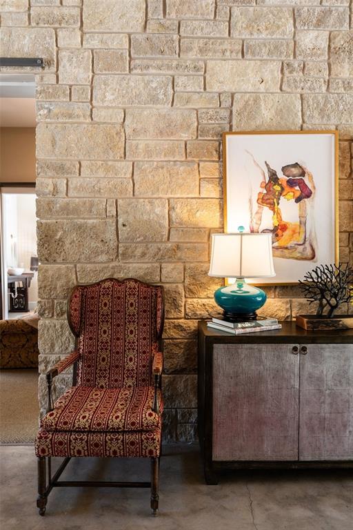 sitting room featuring concrete flooring