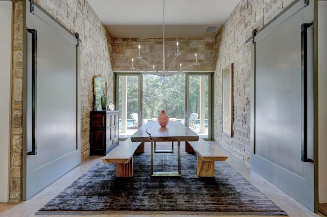 dining room featuring a barn door