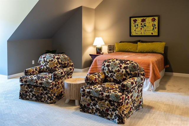 bedroom featuring light carpet and vaulted ceiling