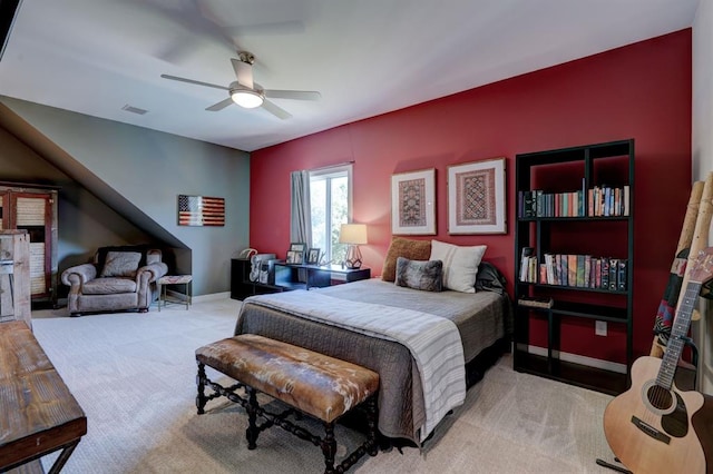 bedroom with ceiling fan and light carpet