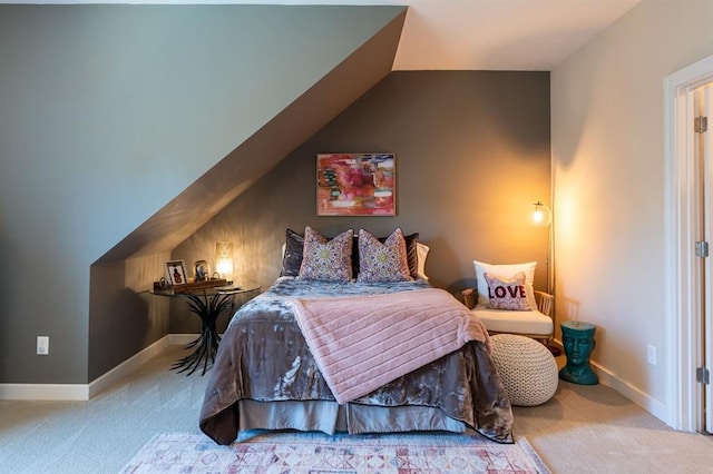 bedroom featuring carpet floors and vaulted ceiling