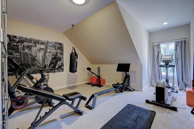 workout room with lofted ceiling and carpet floors