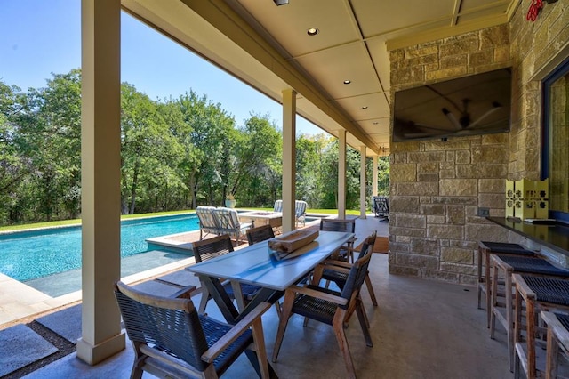 view of patio / terrace featuring an outdoor bar