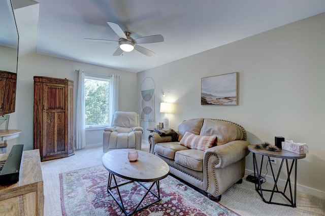 carpeted living room featuring ceiling fan