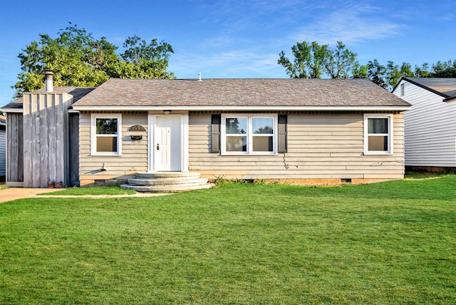 ranch-style home with a front yard