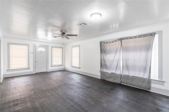 unfurnished room with dark hardwood / wood-style floors, ceiling fan, and ornamental molding