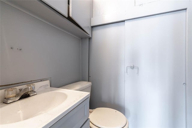 bathroom with vanity and toilet