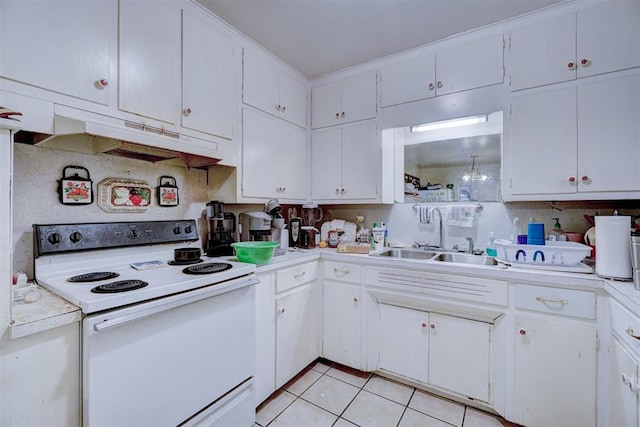 kitchen with white range with electric cooktop, white cabinets, and light tile patterned floors