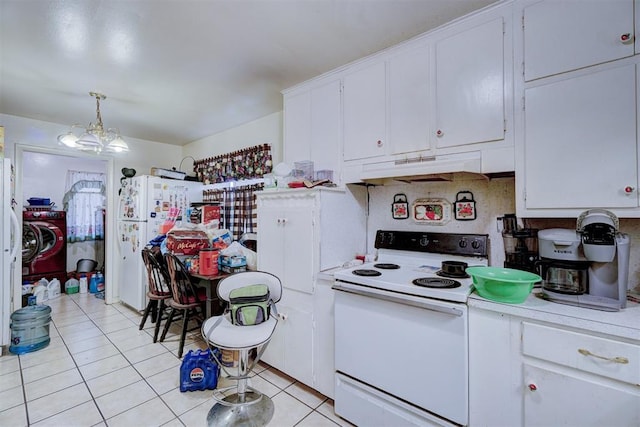 kitchen featuring white appliances, white cabinetry, and hanging light fixtures