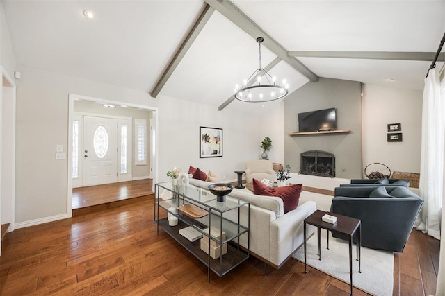 living room with a chandelier, lofted ceiling with beams, and dark hardwood / wood-style floors