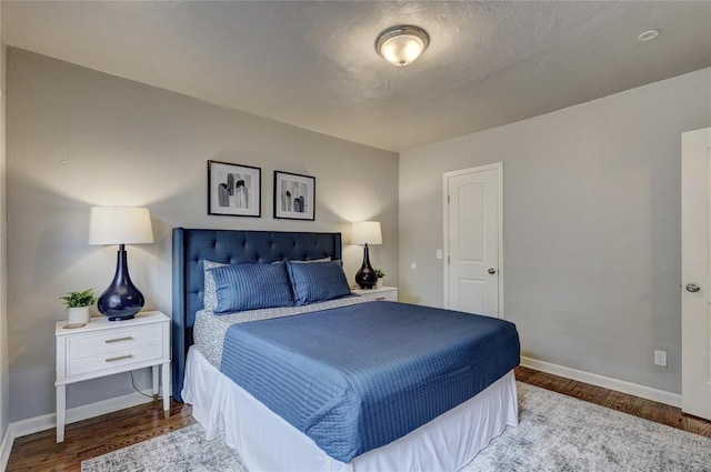 bedroom with wood-type flooring