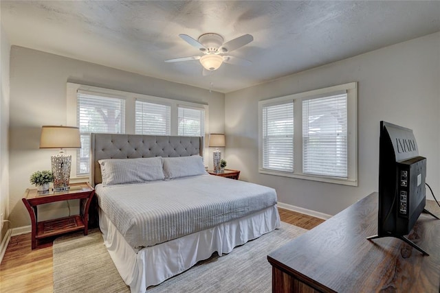 bedroom featuring ceiling fan and light hardwood / wood-style floors