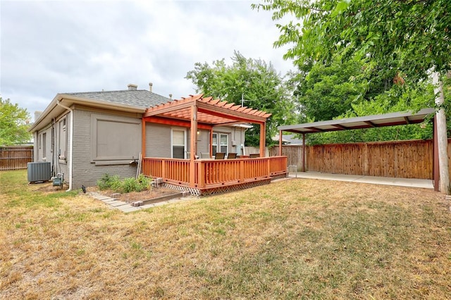 back of house featuring a pergola, central air condition unit, a yard, and a deck