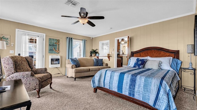 bedroom featuring carpet flooring, ceiling fan, heating unit, crown molding, and ensuite bathroom